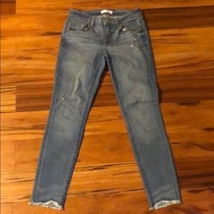 Light wash denim. Frayed end.